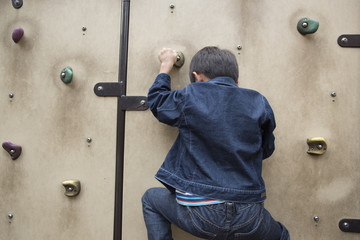 child climbing on a wall