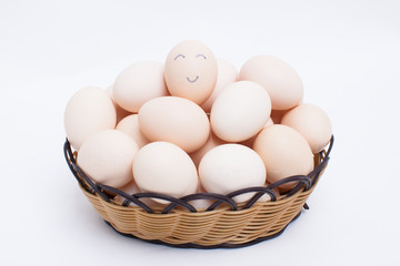 Eggs in basket isolated on white background