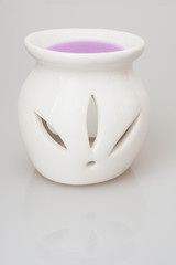Ceramic candlestick with purple scented wax