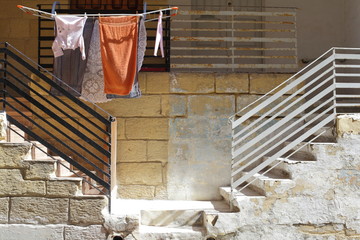 Fototapeta na wymiar Drying clothes on the street, Italy