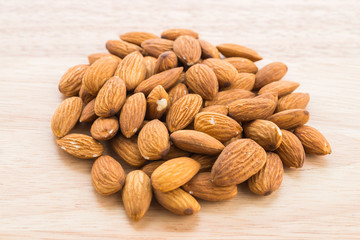 Almond on wooden background