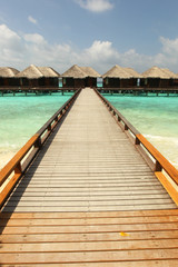 Fototapeta na wymiar Maldives. Villa on piles on water
