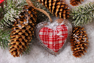 christmas decoration with vintage heart on snow