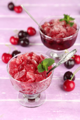 Closeup of cherry granita in glass bowls,