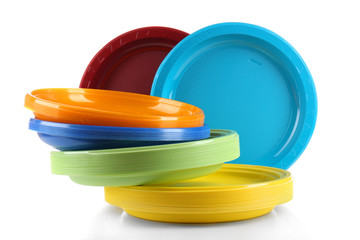 Bright plastic disposable tableware isolated on white