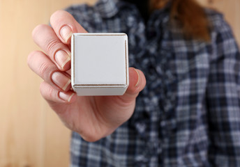 Educational cubes in hands, close-up