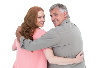 Obraz premium Casual couple standing arms around