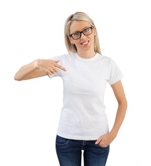 Woman wearing blank white t-shirt and pointing at it