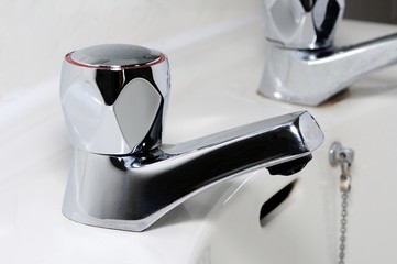 Hot tap on bathroom sink © Arena Photo UK