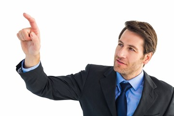 Serious businessman pointing at something