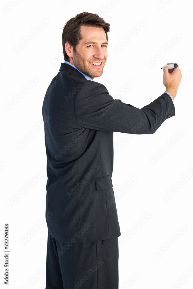 Poster businessman writing with marker while looking at camera