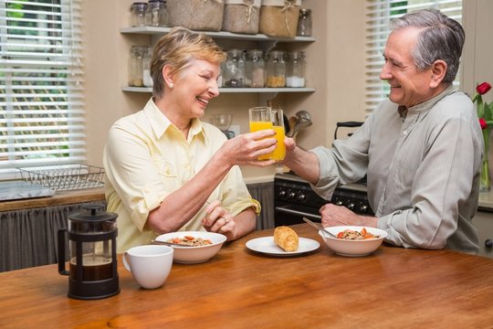 Senior couple having breakfast together