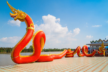 Thai dragon or Naga statue with blue sky background at Thailand