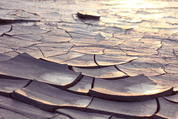 Cracked ground at sunset light;