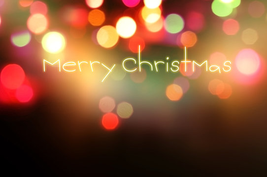 merry christmas written on bokeh background