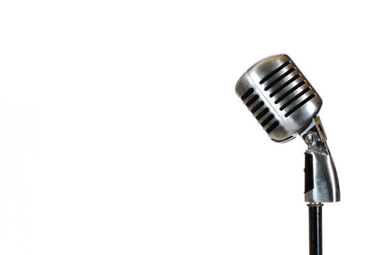 Silver vintage microphone in the studio on white background