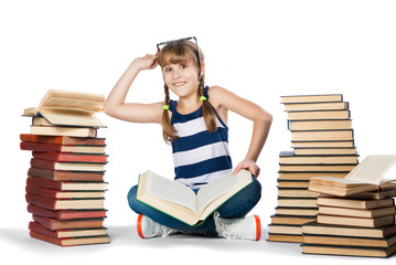 happy little girl reading a book