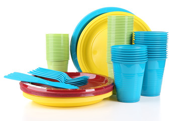 Bright plastic disposable tableware isolated on white