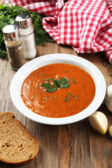 Delicious lentil cream-soup on table close-up
