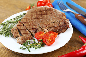 Delicious grilled meat on table