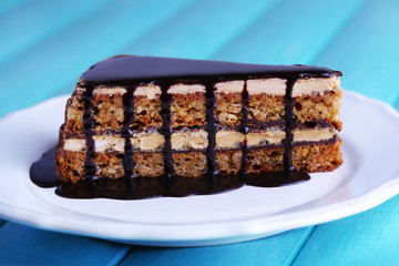 Delicious chocolate cake on plate on table close-up