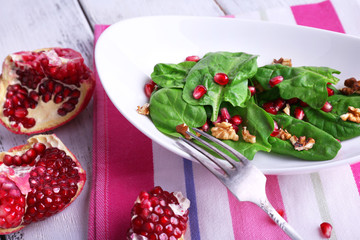Fresh salad with greens, garnet and spices