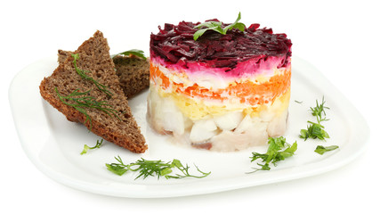 Russian herring salad on plate isolated on white