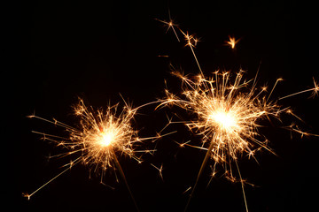 Fototapeta premium Two burning christmas sparklers