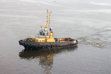 A tug boat stands ready to help ships in st. petersburg , russia