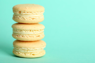 Gentle colorful macaroons on color background