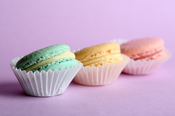 Gentle colorful macaroons on color background