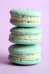 Gentle colorful macaroons on color background