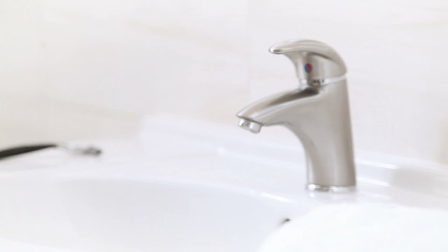 Young female Hand washing with dolly-in and dolly-out technique