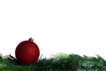 Christmas ball with green fir-tree branch