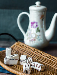 unpacked candy in a wooden basket, tea
