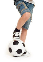 Fototapeta premium feet shod in sneakers and soccer ball