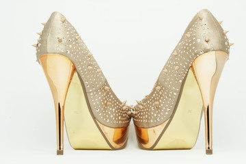 Gold shoes with spikes on 14cm heels.
