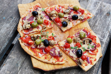 Italian pizza with mushrooms, cheese and olives