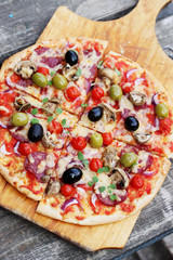 Italian pizza on a wooden board