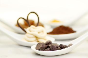 chocolate drop in the foreground with other sweet ingredioents i