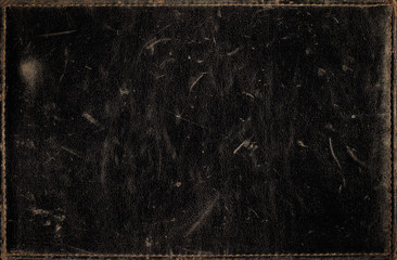 Black grunge background from distress leather texture