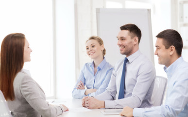 smiling businesswoman at interview in office