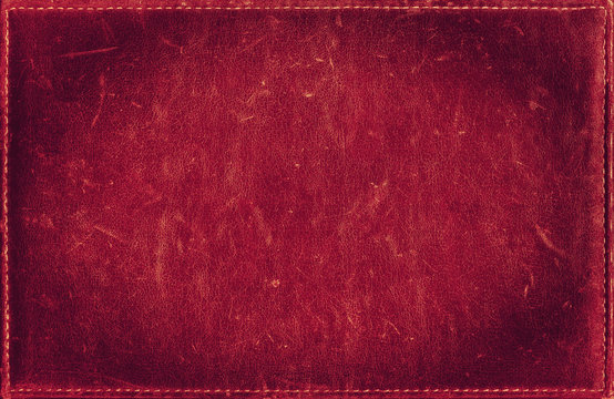 Red grunge background from distress leather texture