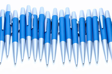 Silver-blue metal pens isolated on white background.