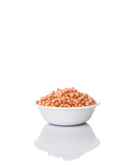 Peanut or ground nut in white bowl over white background