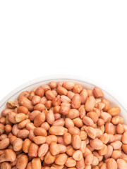Peanut or ground nut in white bowl over white background