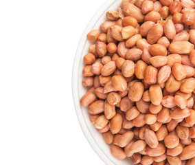 Peanut or ground nut in white bowl over white background