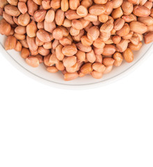 Peanut or ground nut in white bowl over white background