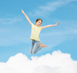 Fototapeta na wymiar smiling little girl jumping