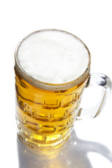 Mug with beer isolated on white